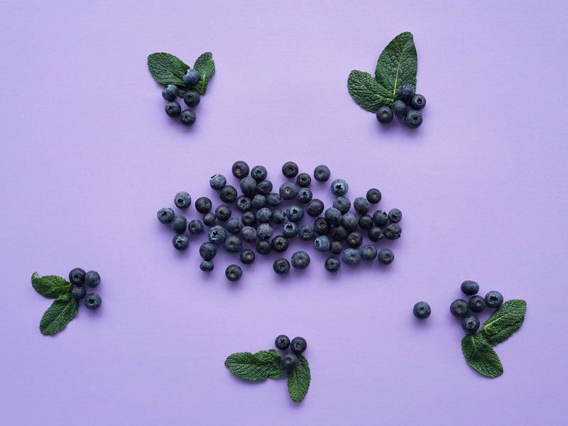 blueberry kombucha flavoring on purple background