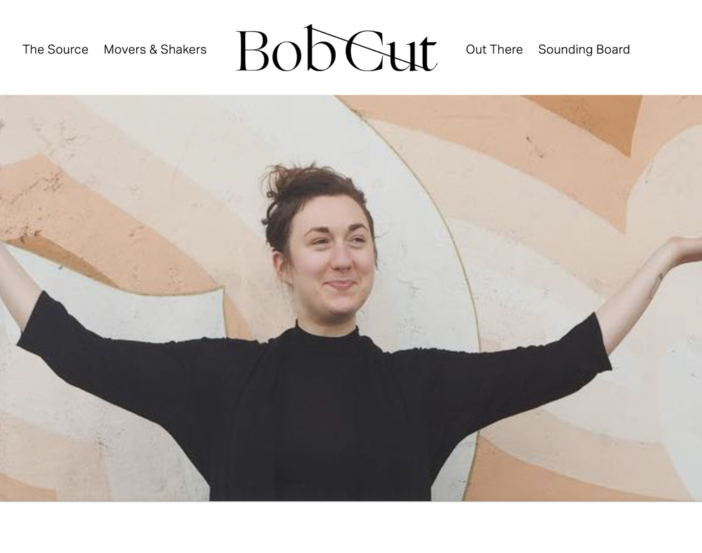 bob cut magazine woman with arms up